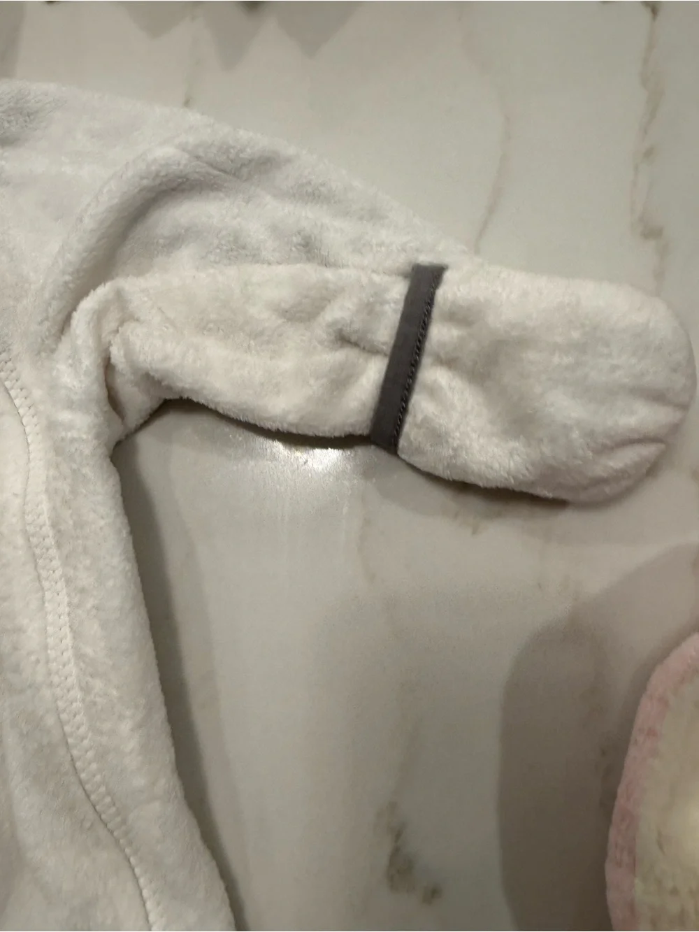 The North Face White Fleece Baby One-Piece with Gray Trim